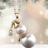 Charming gold-plated snowman necklace on a festive background.